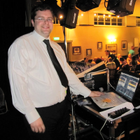 Photo of DJ David Graham behind the rig